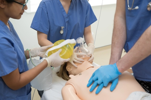 Students learning in a medical simulation lab