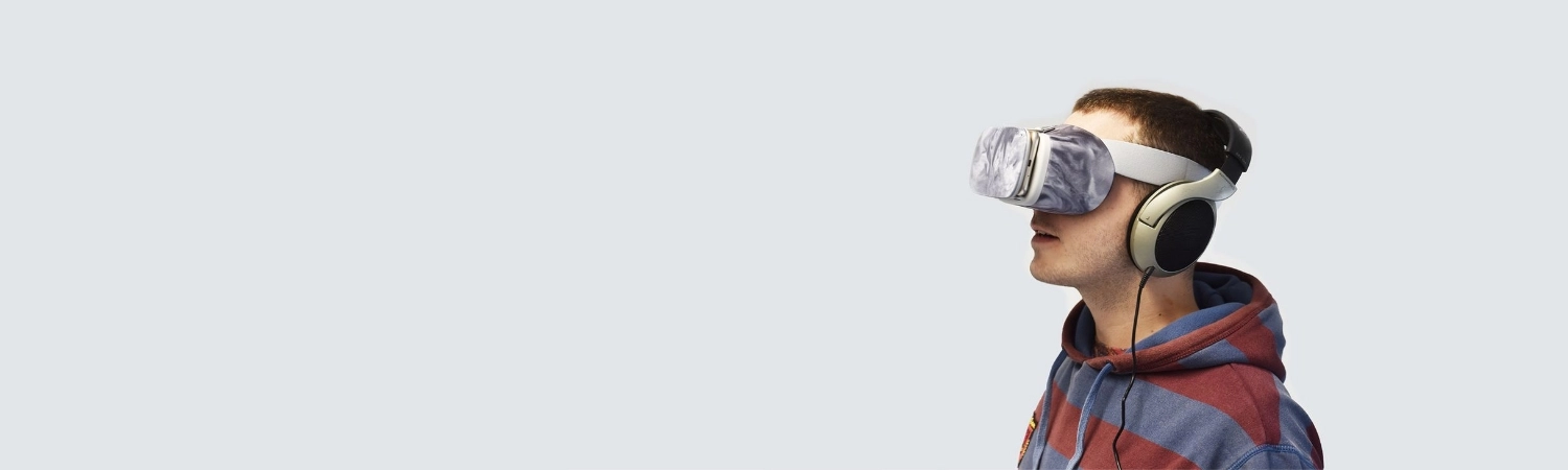 Man looking through a AVR headset.