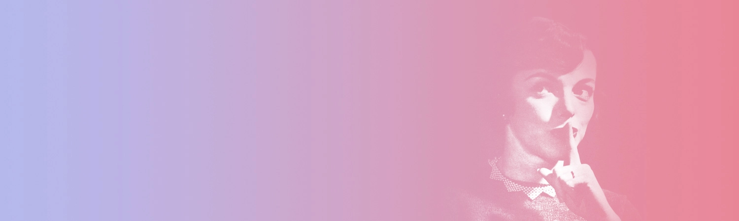 A woman whispering with her finger over her mouth