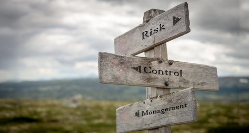 wooden signposts for risk, control and managment