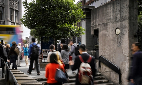 People exiting the Arts Building on to Nassau Street.