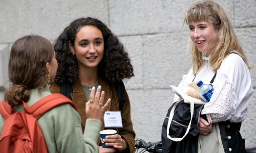 Trinity students talking and laughing.